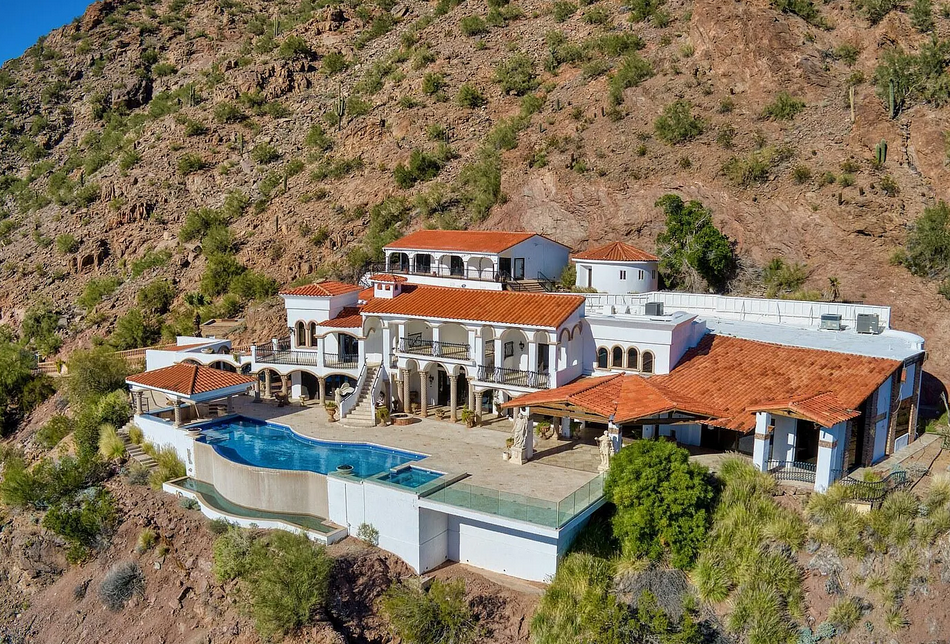 Aerial view of luxury Arizona hillside estate with pool
